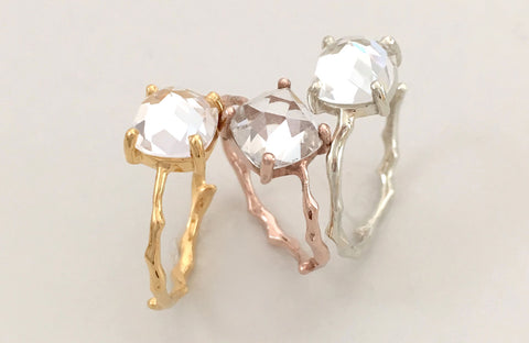 statement rings with white topaz focal stone available in yellow gold, rose gold and white gold