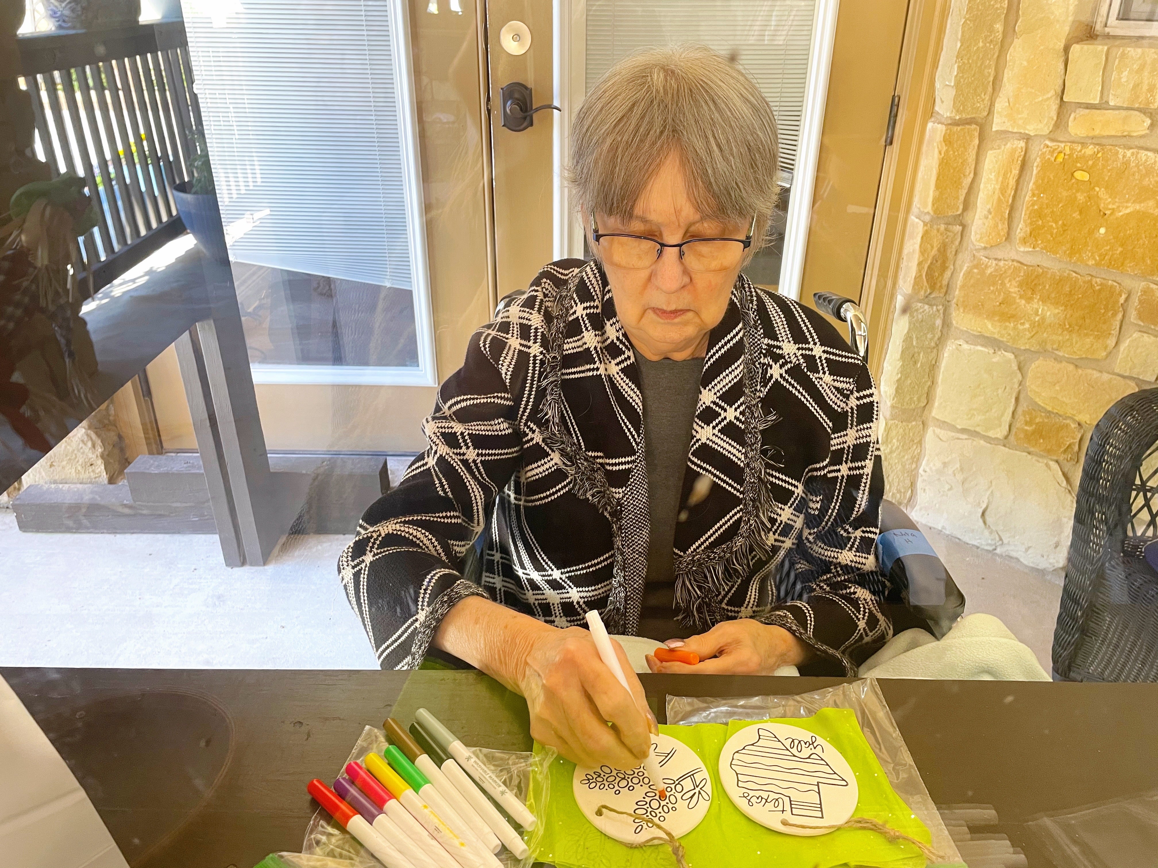 Mom with dementia coloring at Tiffin House