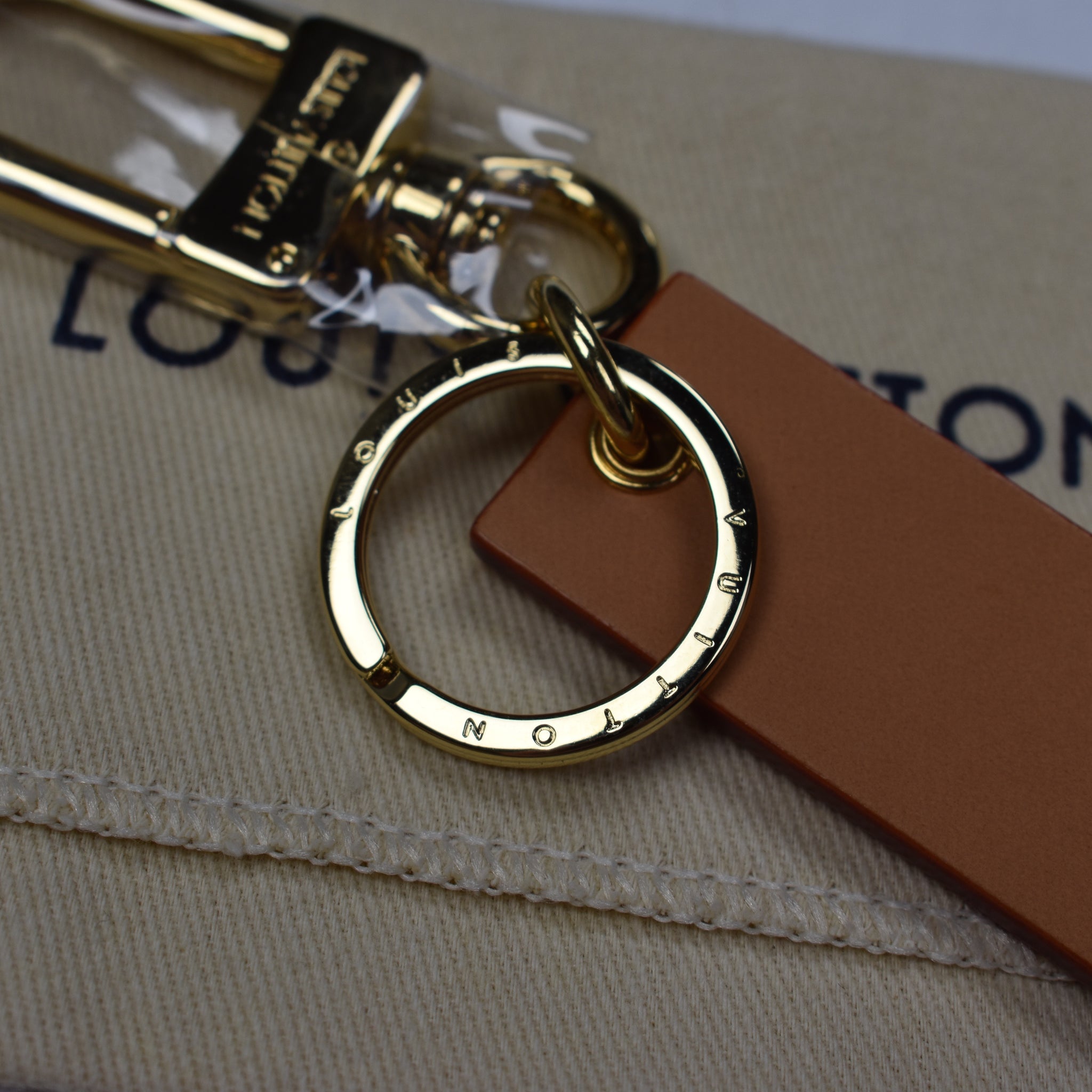 Louis Vuitton x Supreme - Tan Leather Box Logo Embossed Keychain – eluXive