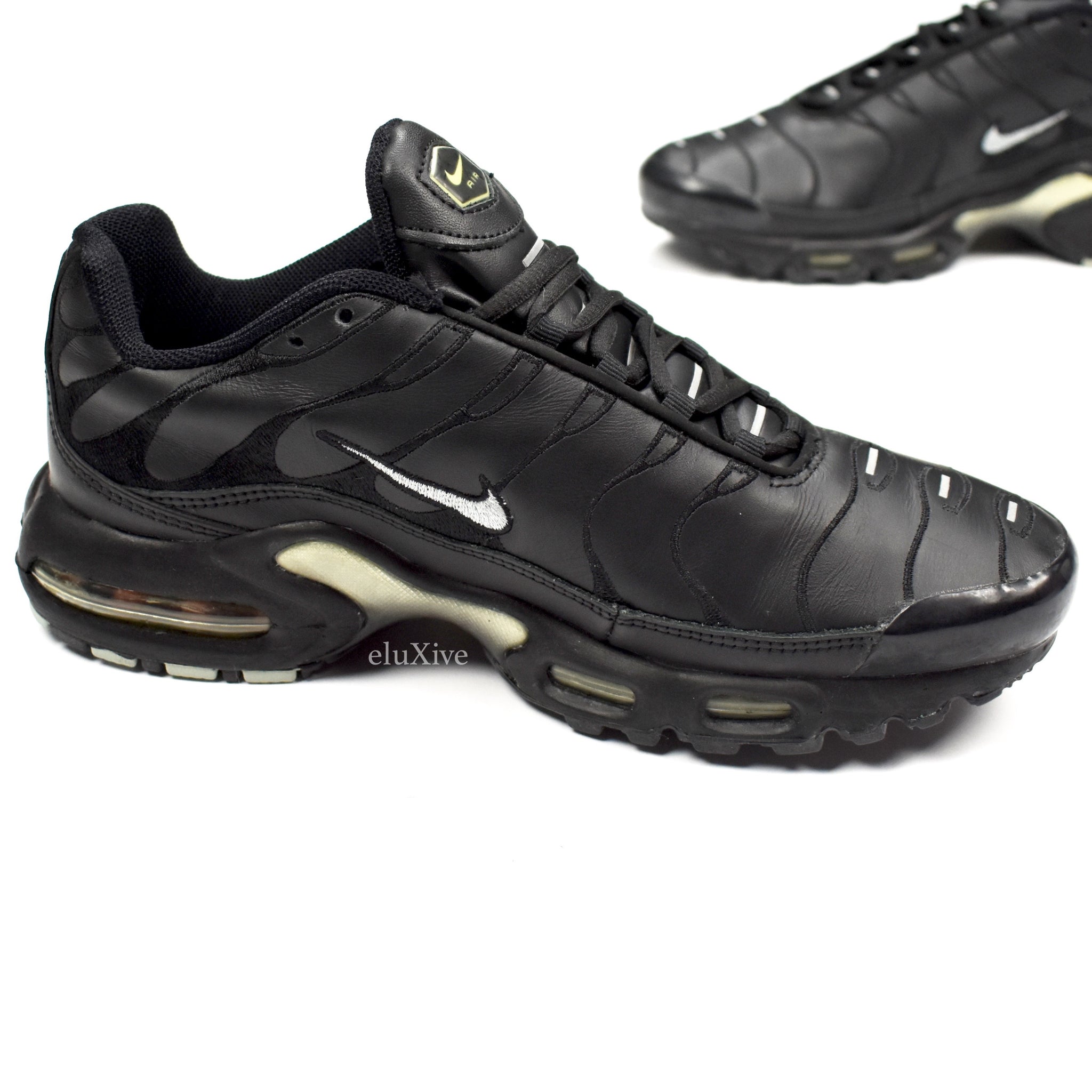 black leather nike tns