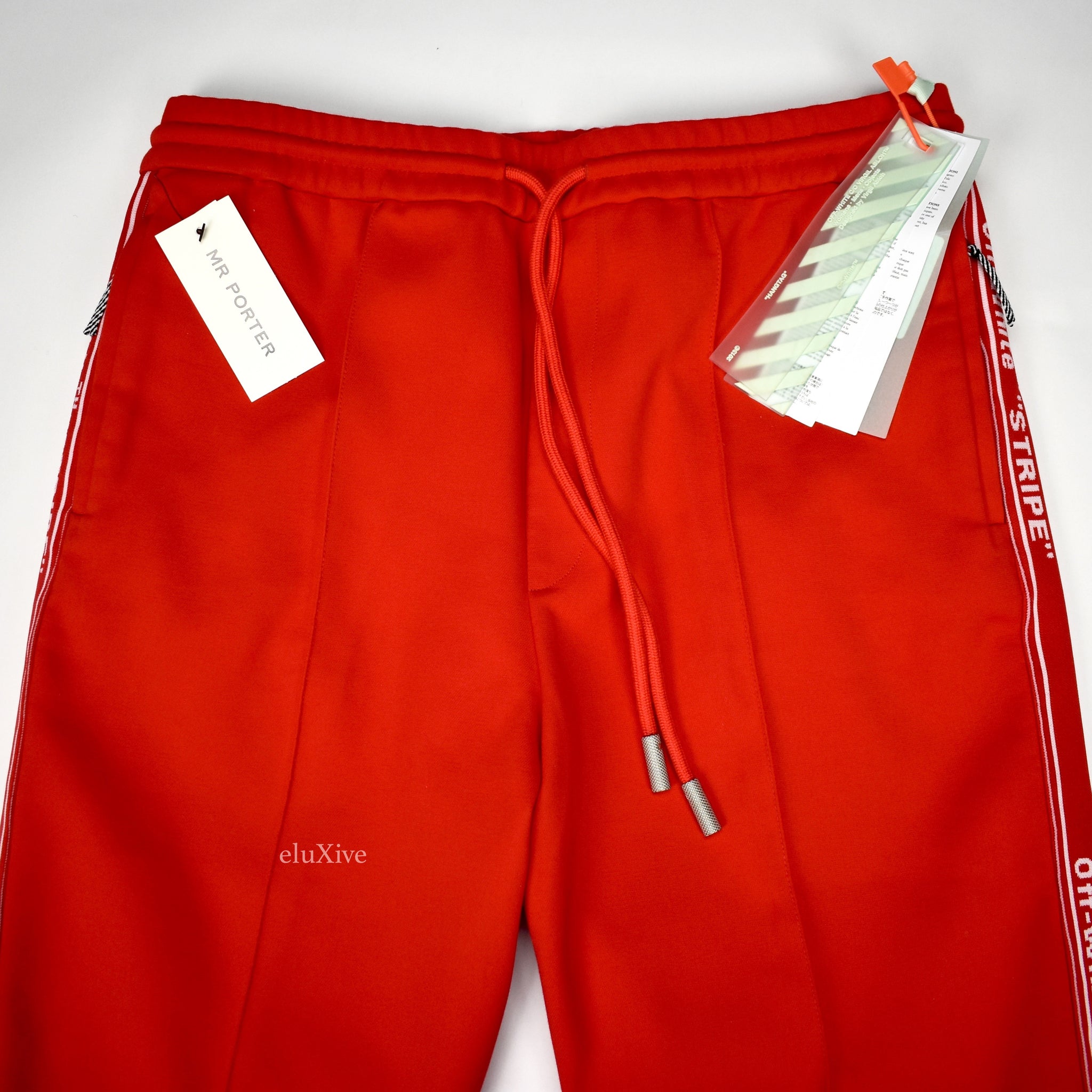 white track pants red stripe