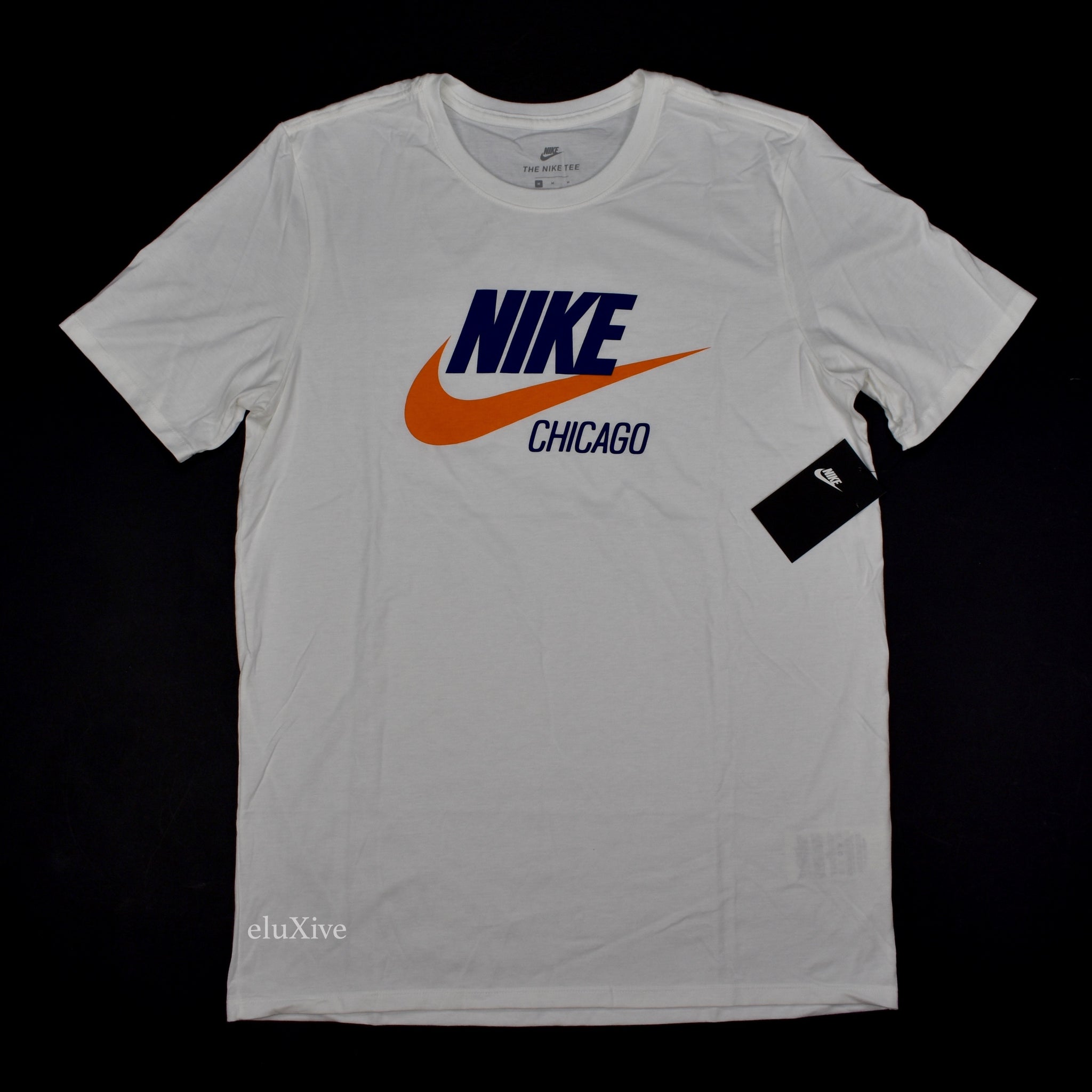 white and orange nike shirt