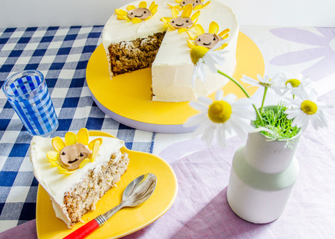 fun cake idea: hummingbird cake decorated with smiling sunflowers for Lunch Lady Magazine