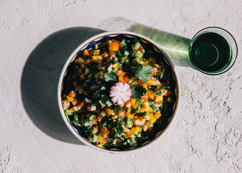 Aerial photo of a bowl of arabic salad made by Aseel Tayah