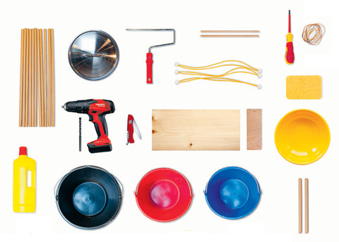 DIY drum kit materials including a drill, buckets, paint roller, wood and screw driver