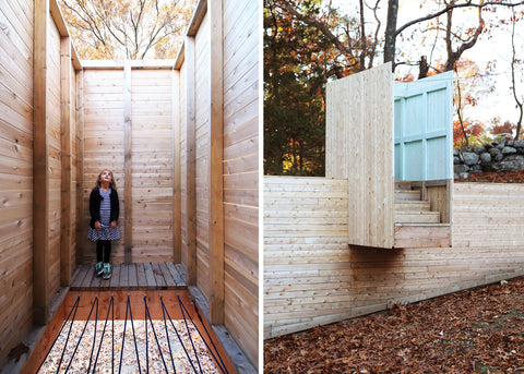 a photo of a girl inside the five fields playground looking up. A rope flooring is in front of her. A stairway to nowhere is photographed beside her.