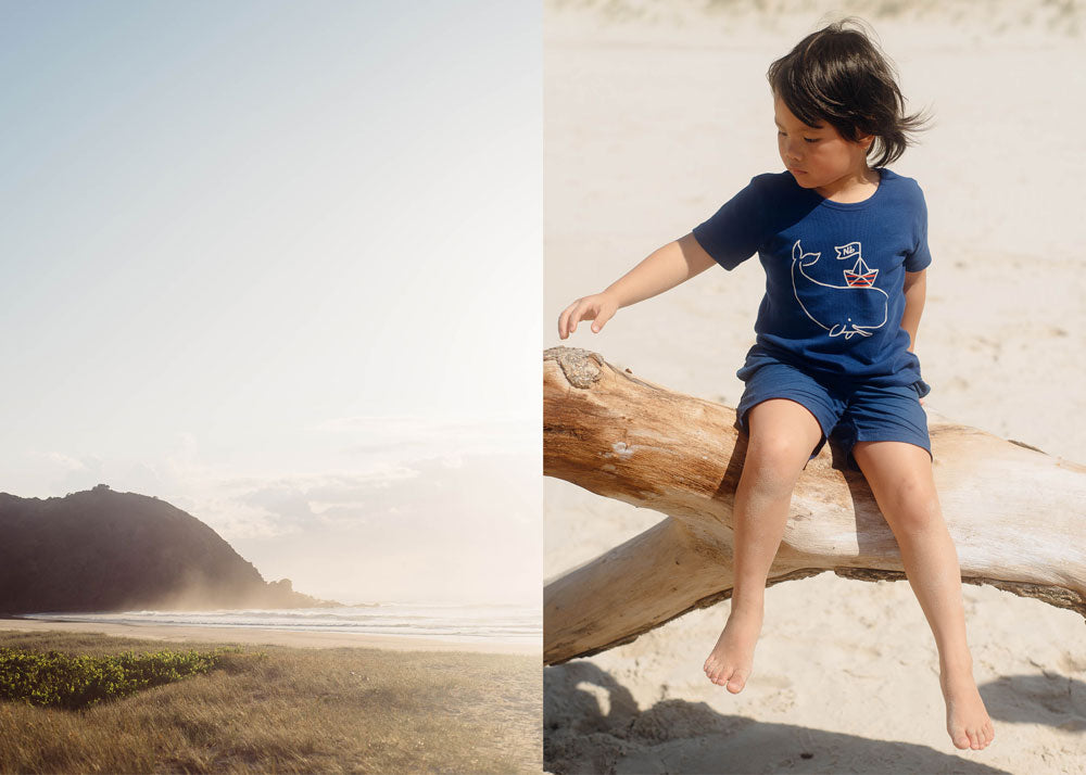 The Byron Bay coastline and a little boy wearing clothes from Nature's Baby