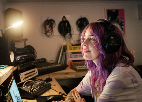 Photo of Nici Ward in a recording studio for Lunch Lady Magazine Parents who Play feature