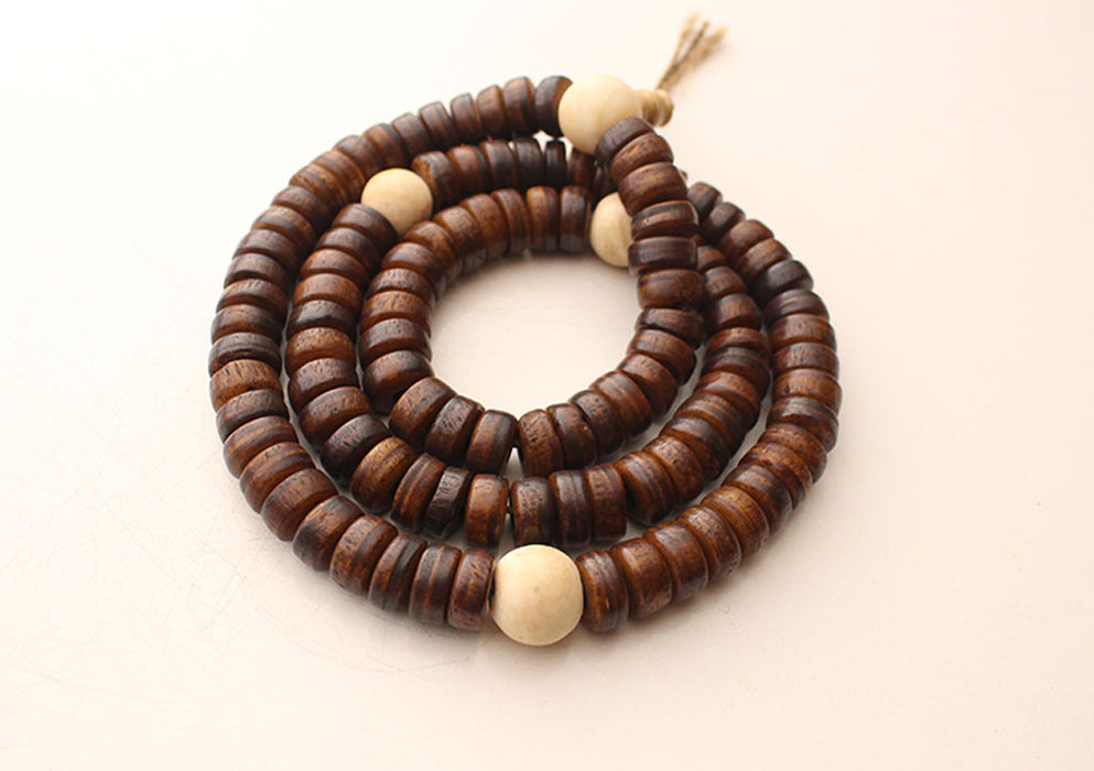 Disk Shaped Brown Yak Bone Japa Mala With White Conch Counter
