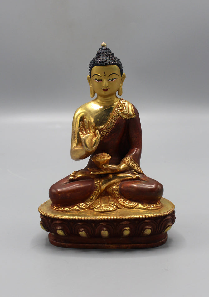 Meditating buddha statue in avaya mudra known as Blessing Buddha