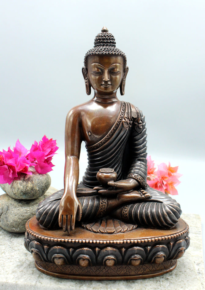 Meditating buddha statue in Bhoomi sparsa mudra known as earth touching Buddha