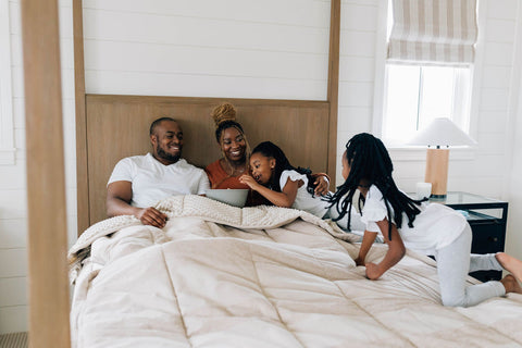 family sits in their halson zipper bedding