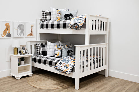 Checkered zipper bedding adorns a white bunk bed.