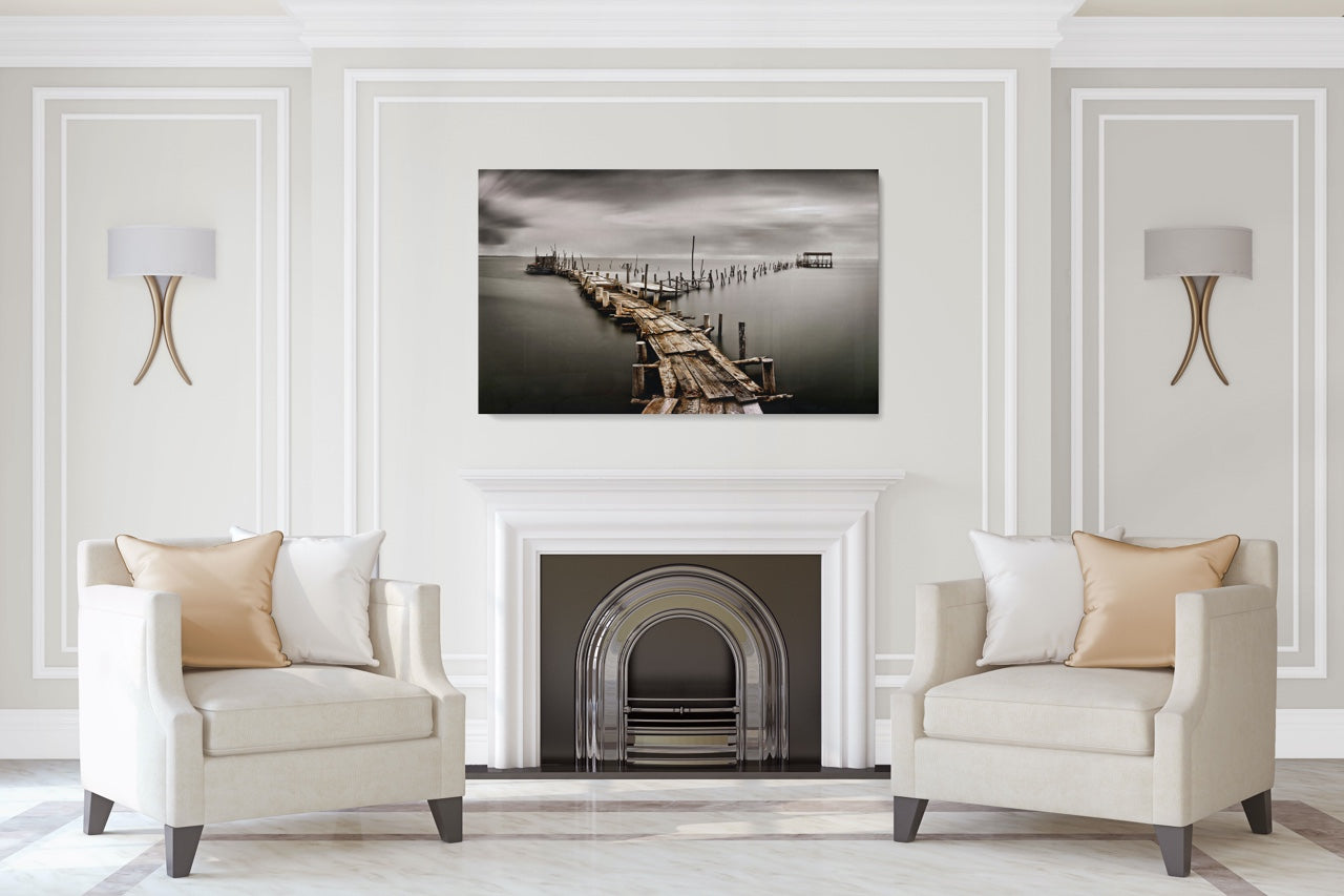 Black and white pier photo art in a modern living room