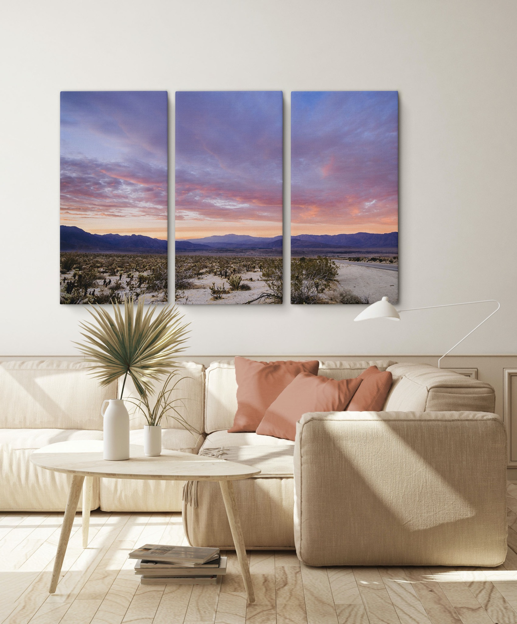 desert wall art triptych over a beige sectional