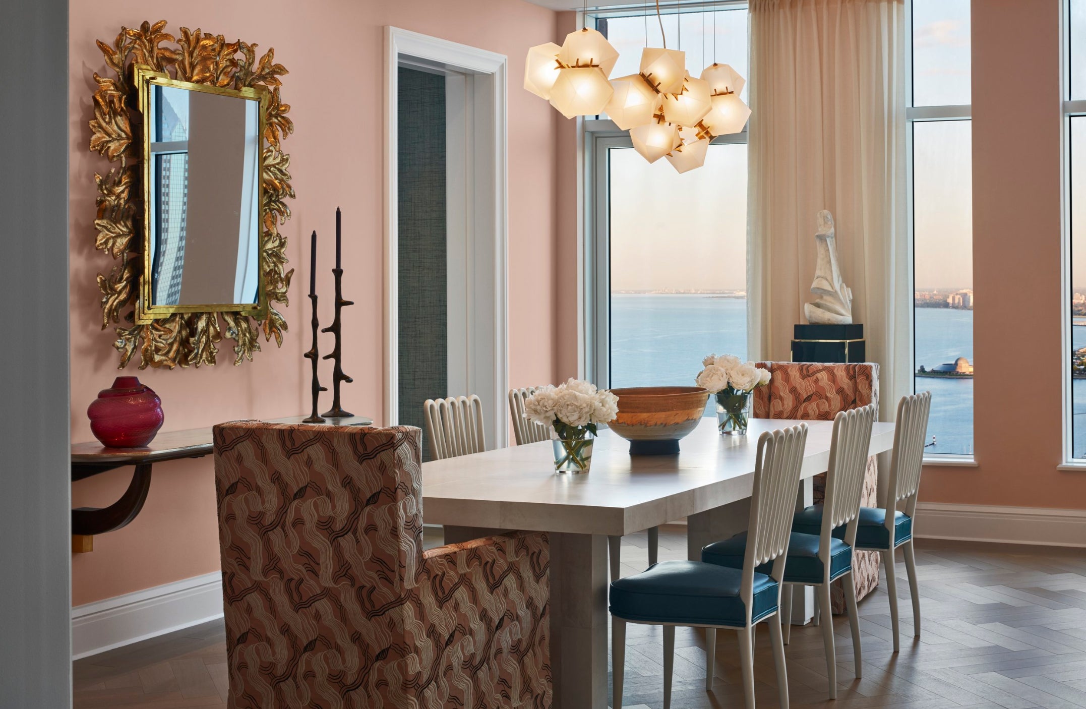 elegant dining room with peach accent wall