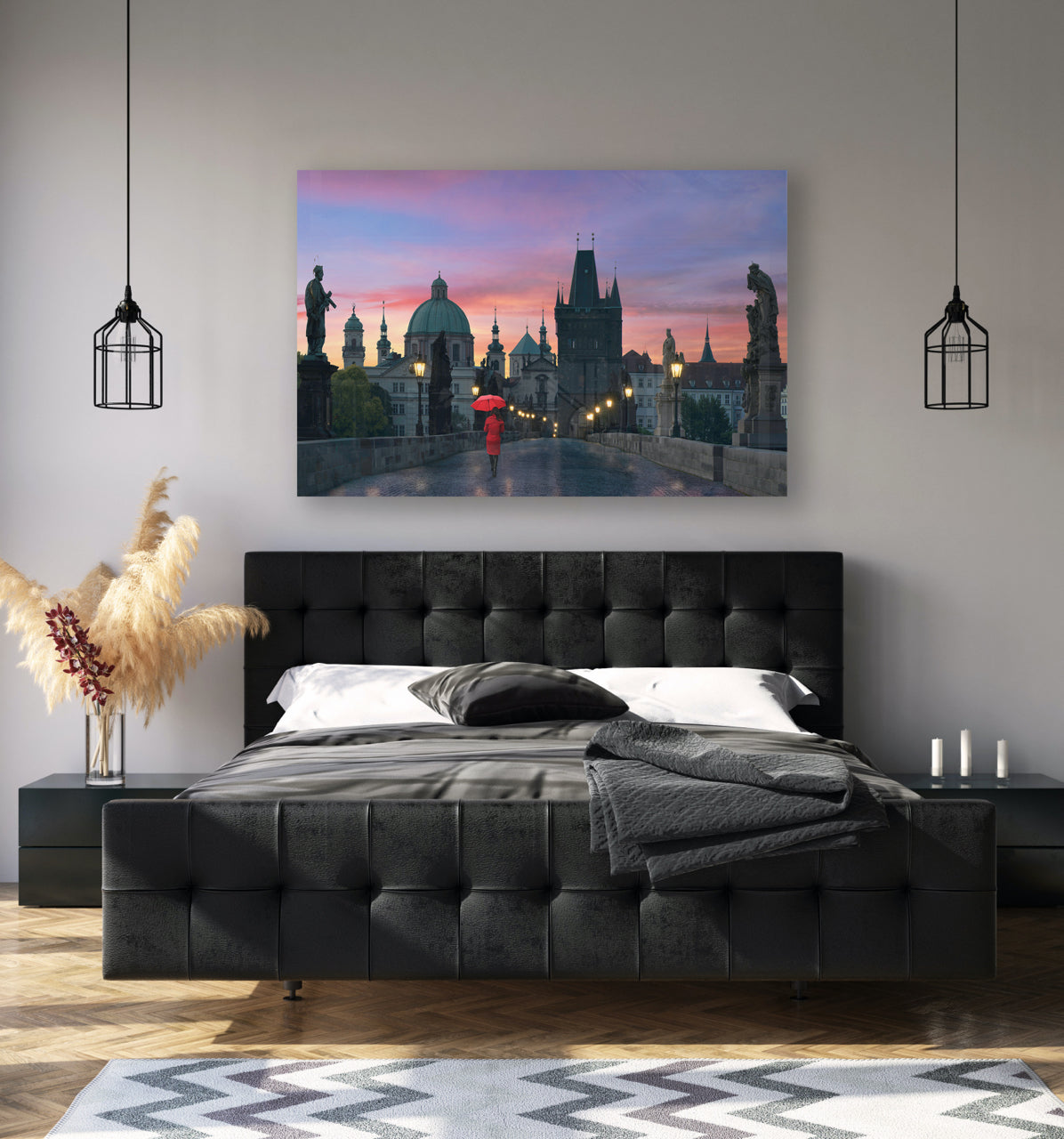 bedroom with black bed and large artwork