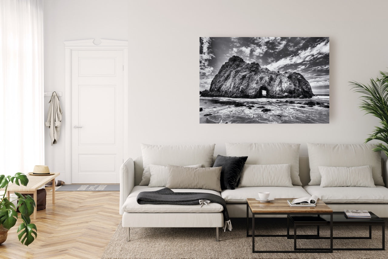 Modern living room with black and white beach wall art