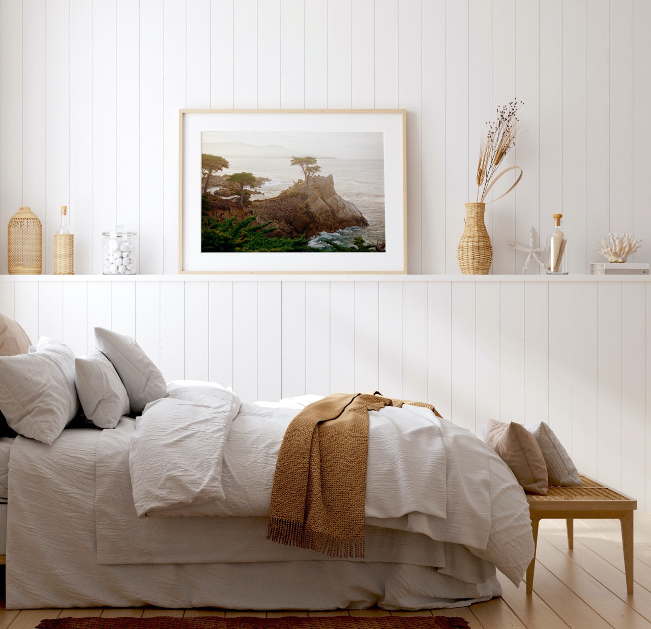 Coastal bedroom with framed art print