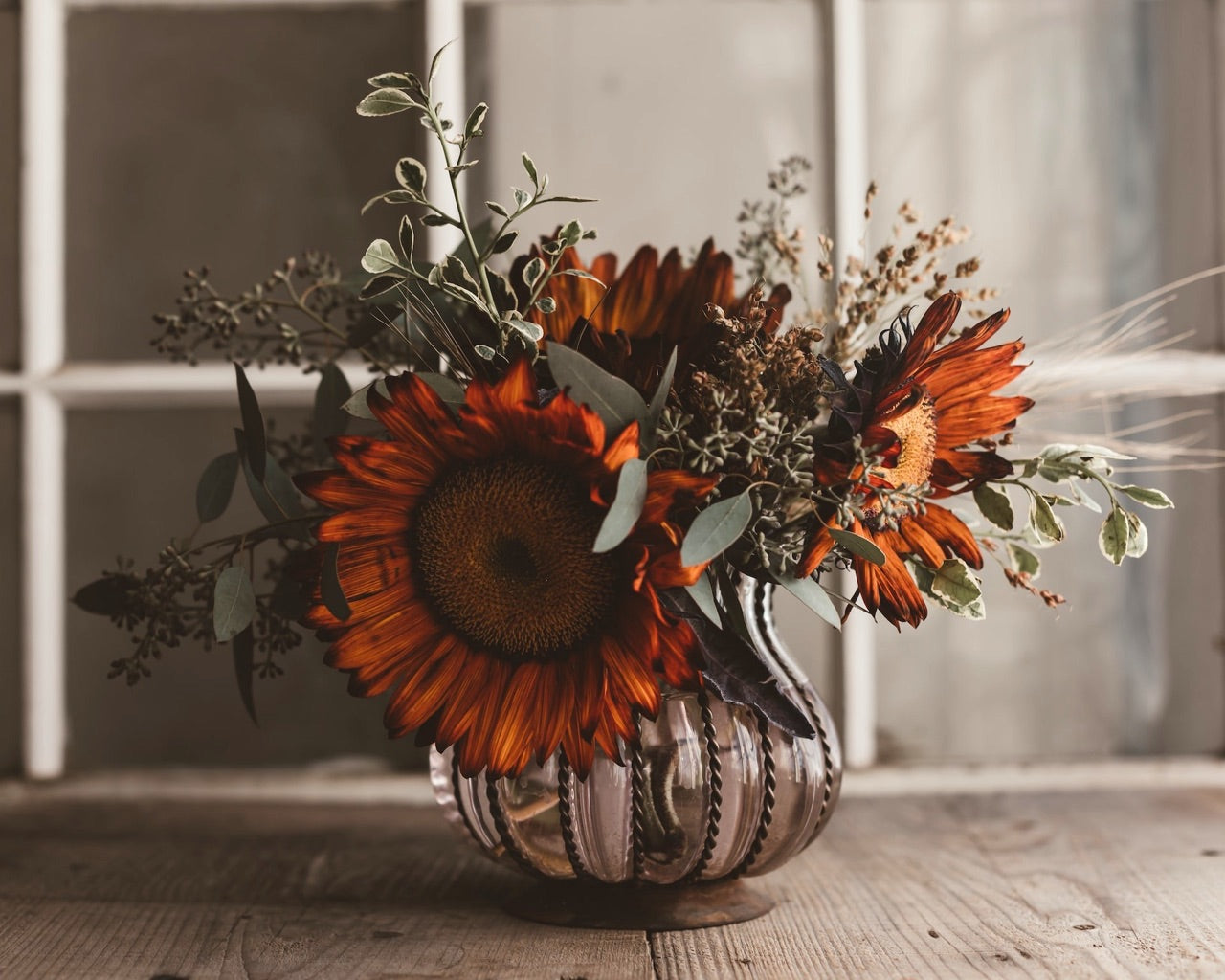 red sunflower and greenery