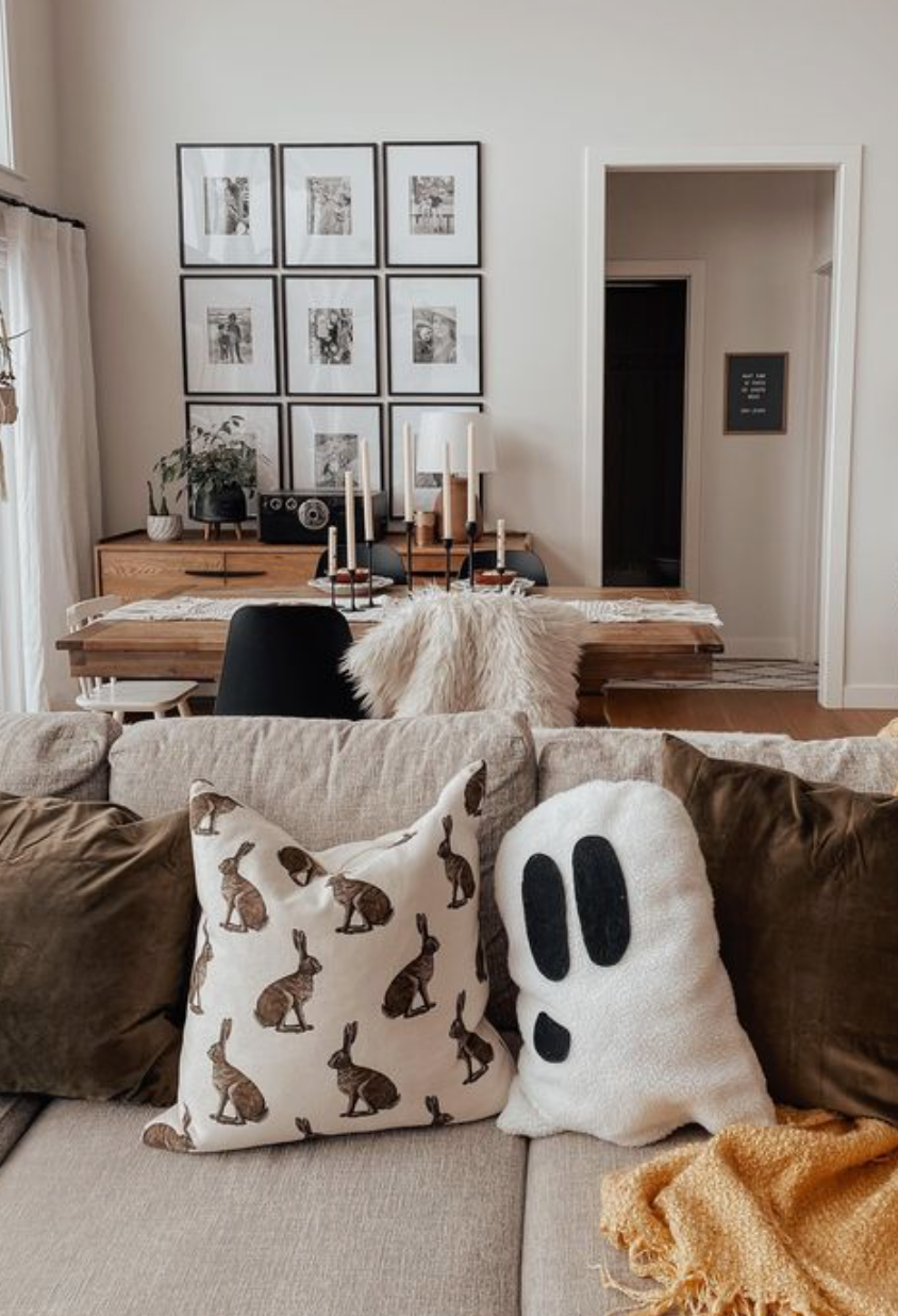living room with Halloween decor on couch