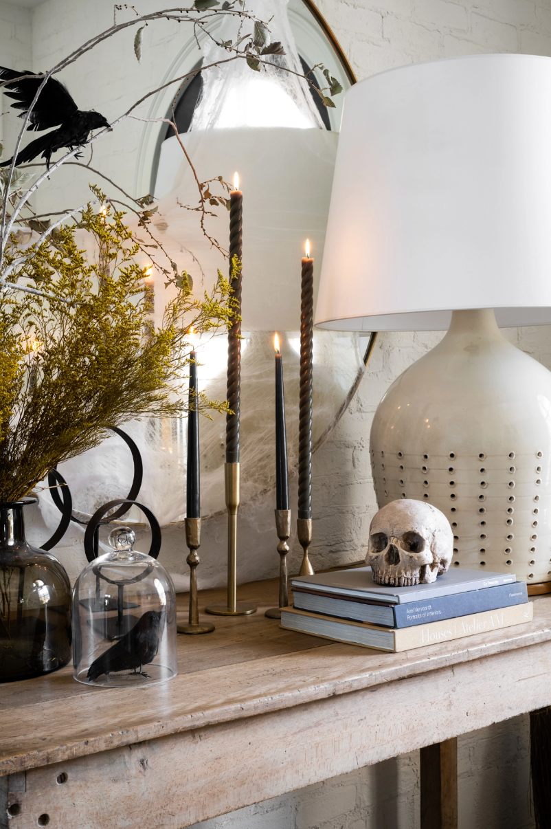 Console table with Halloween decorations