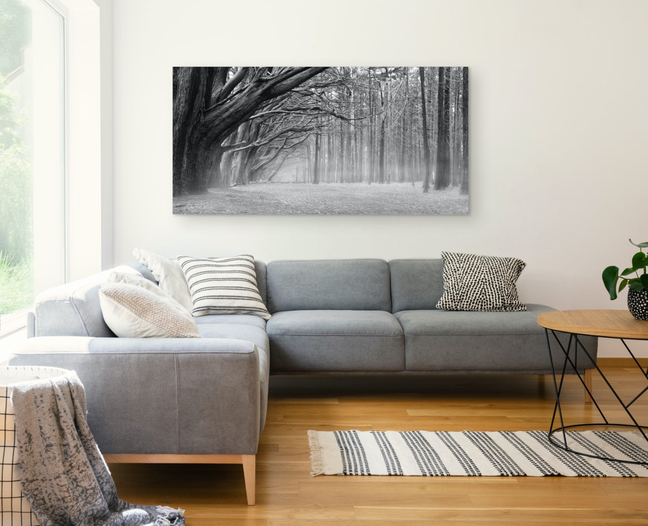 Black and white forest wall art in modern living room