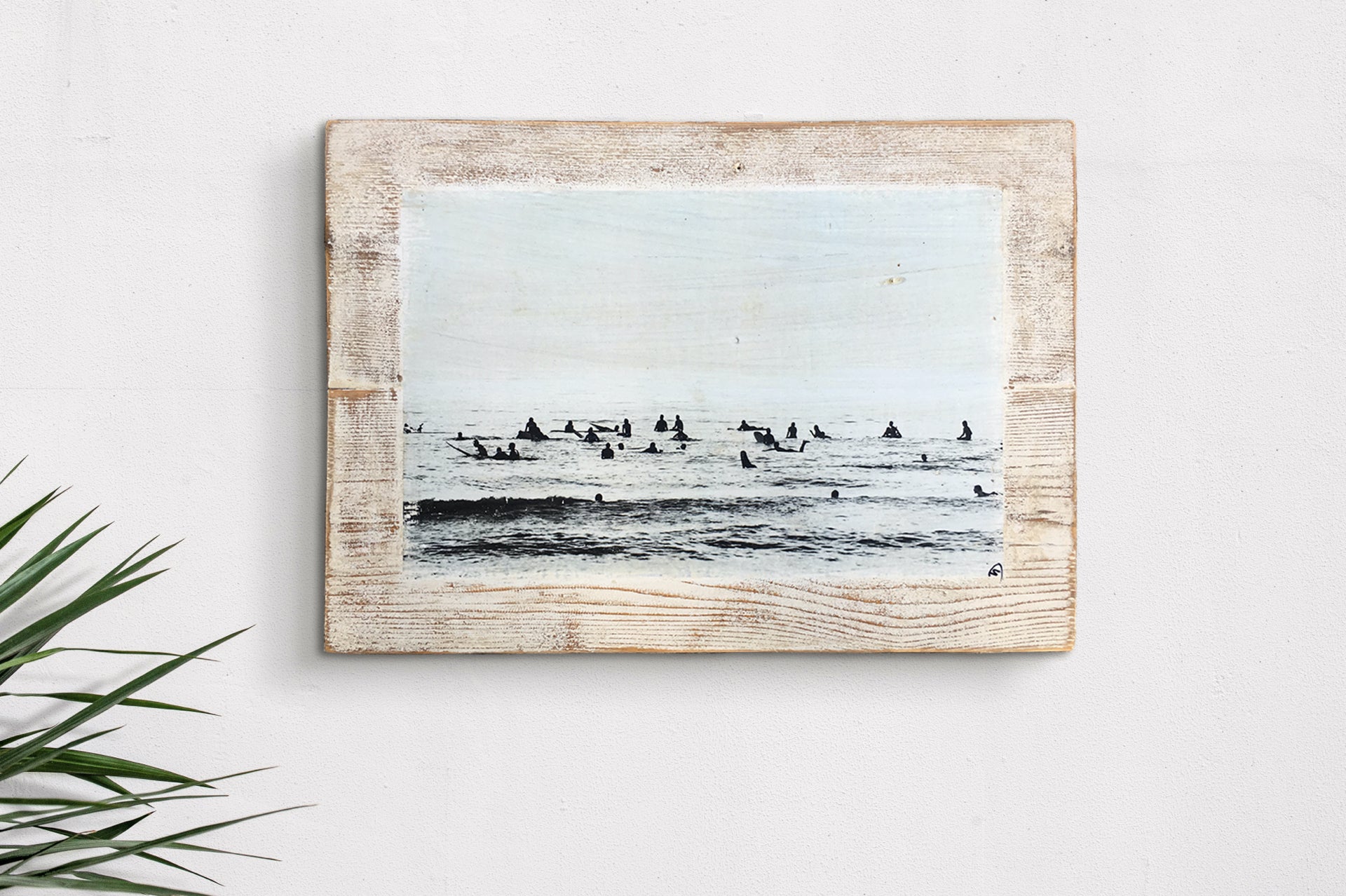 black and white surf photograph on wood