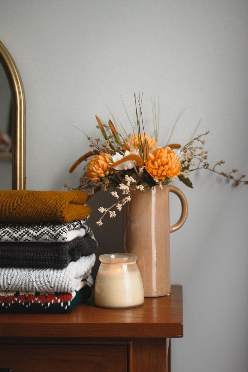 orange fall flowers and blankets