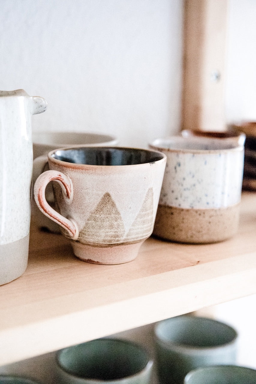 mugs in coastal farmhouse kitchen