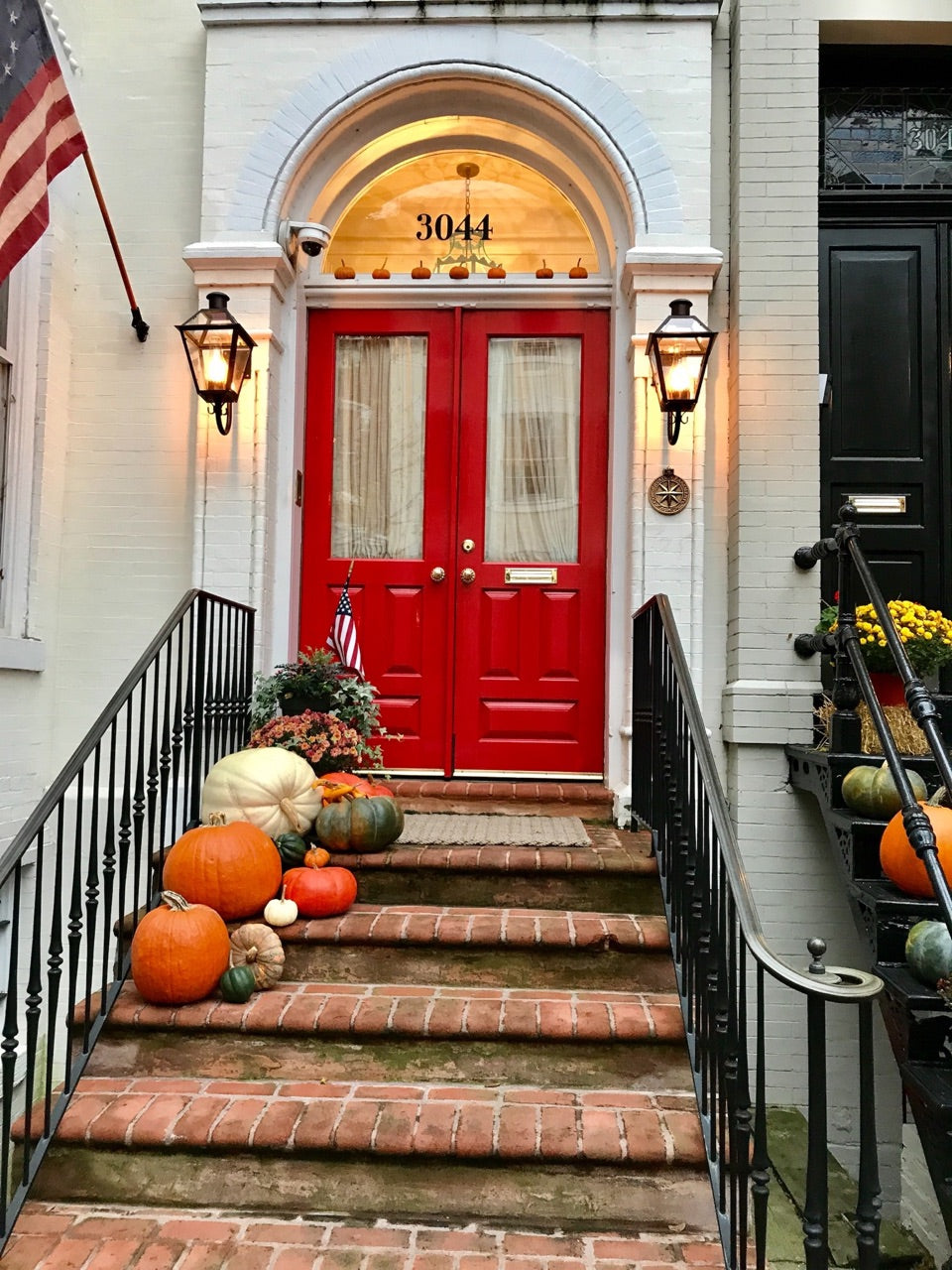 fall front porch with pumpkins