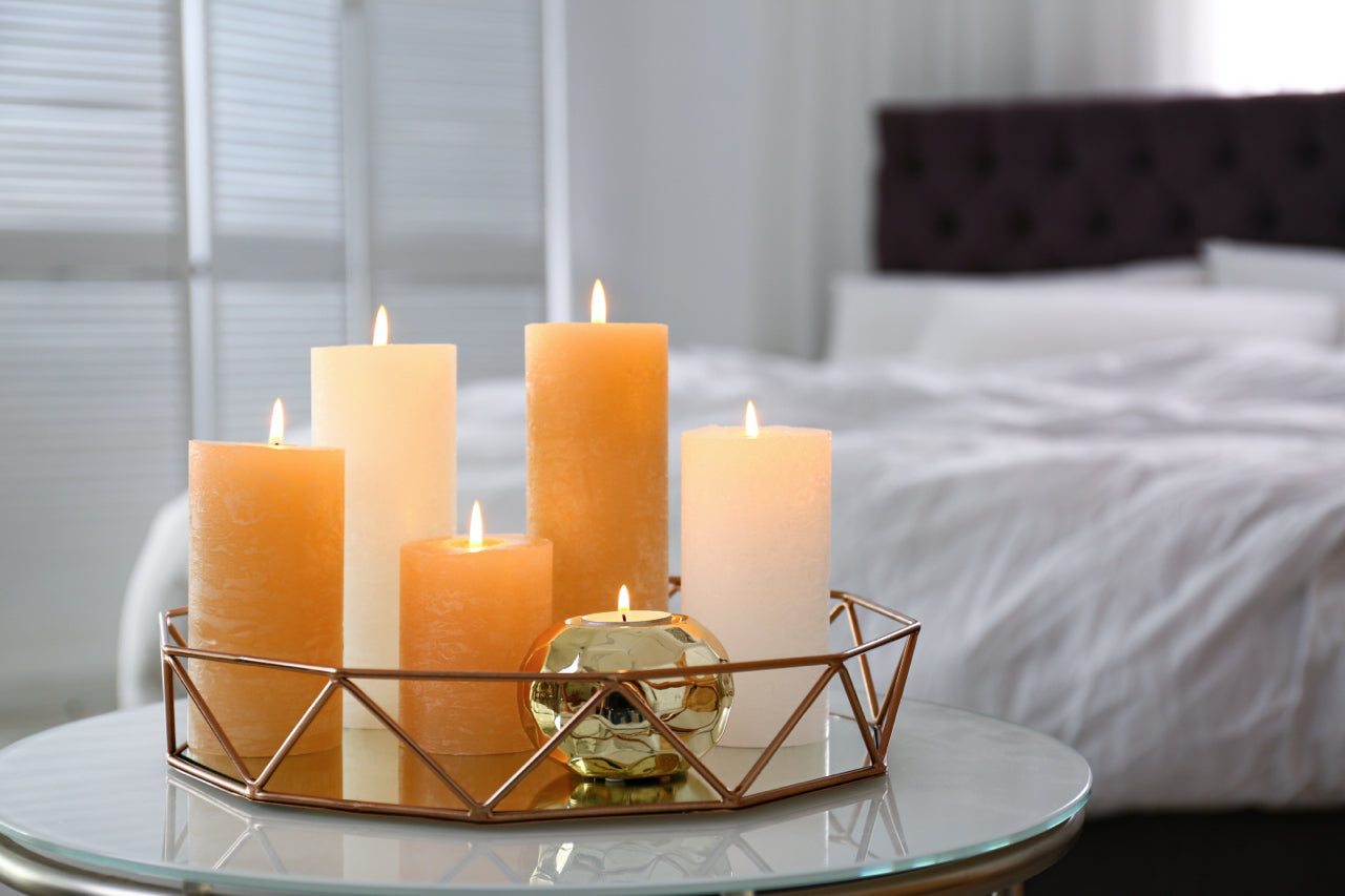 candles on a tray in a bedroom