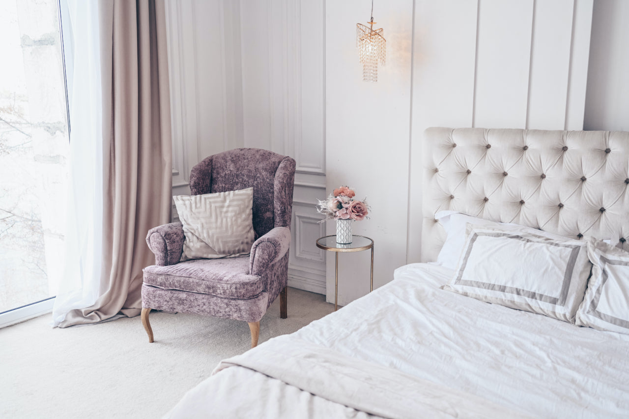 traditional romantic bedroom with lavender accent chair