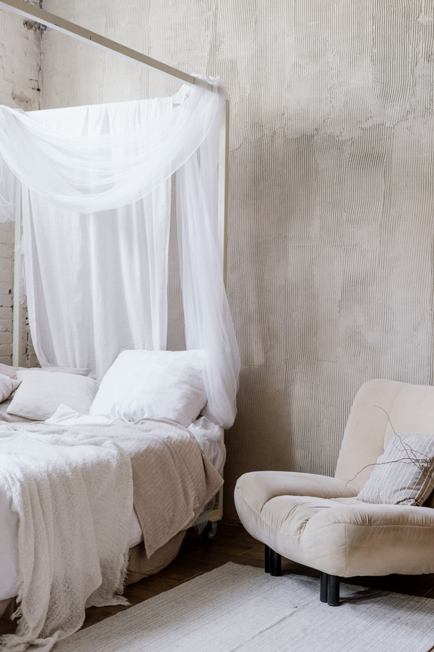 romantic canopy bed with sheer curtains