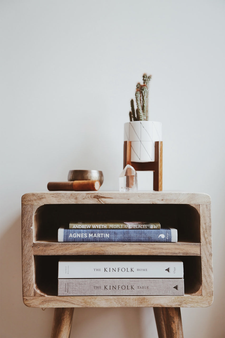 rustic bedside table with plant