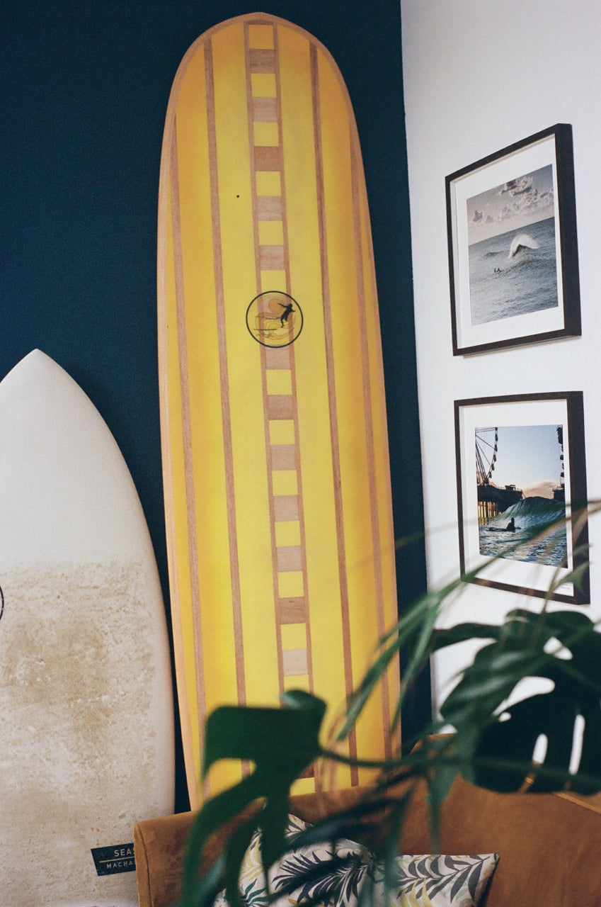 yellow surf board in beach house