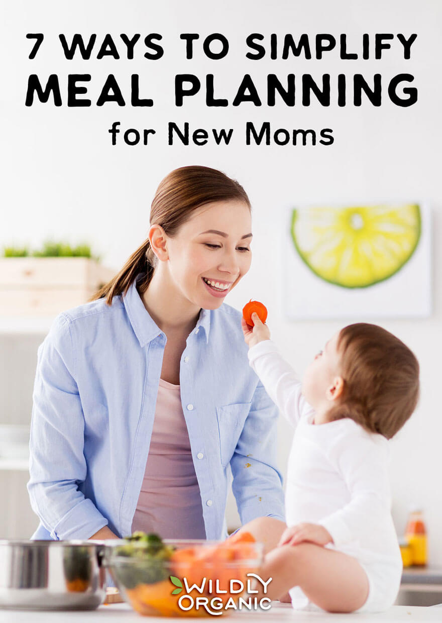 Photo of Mom and Toddler in the kitchen eating veggies | 7 Ways to Simplify Meal Planning for New Moms | Seven ways to simplify meal planning to allow you to spend less time stressing in the kitchen and more time focusing on your family. #mealplan #mealprep #realfood #easyrecipes #healthyliving #healthylife #newmom