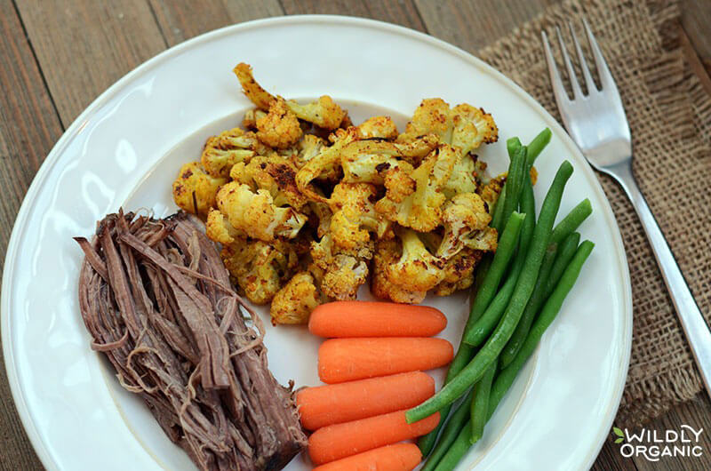 Roast beef, green beans, carrots, and roasted cauliflower Dinner plate