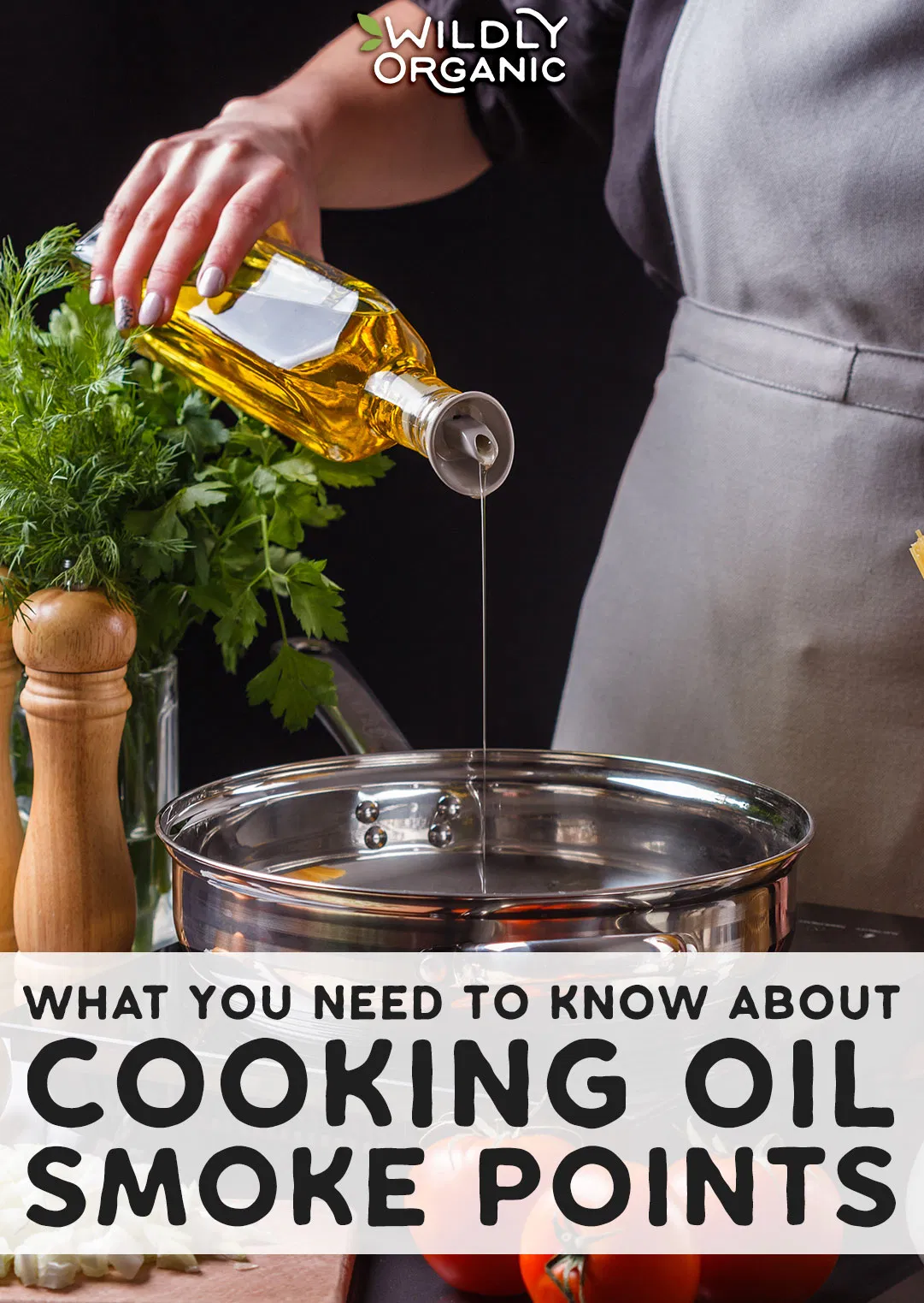 A photo of a woman in plain dress pouring oil into a large stainless steel pan with herbs and salt and pepper grinders on the tab;e with tomatoes and garlic on a wooden cutting board.blog post image