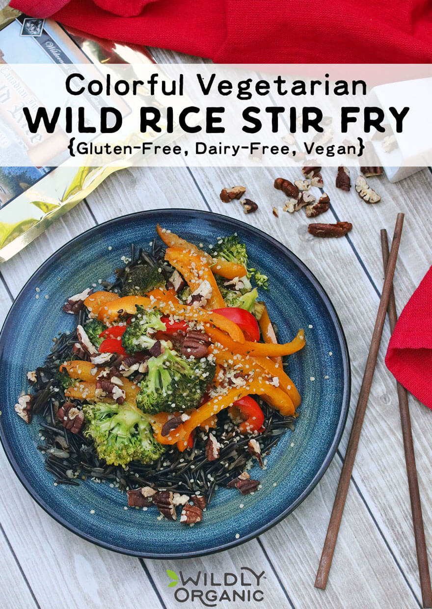 Photo of finished colorful stir fry | This colorful vegetarian wild rice stir fry dish takes under thirty minutes to make, making it ideal for a busy weeknight dinner and contains a host of awesome vitamins and fueling nutrients. While it is a vegan dish, feel free to top it with your favorite protein to give it a bit of a boost. Gluten-free, dairy-free, and egg-free too!