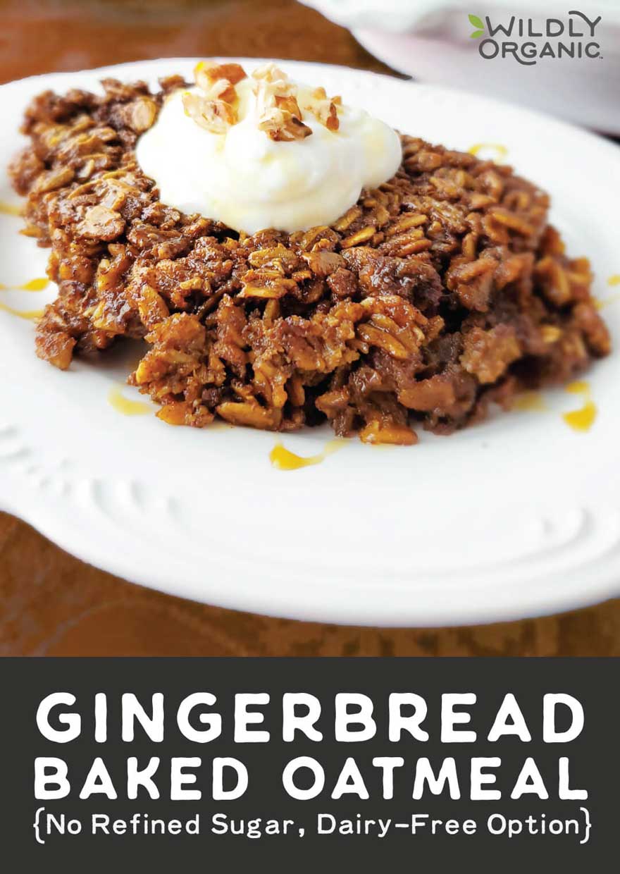 A photo of gingerbread baked oatmeal on a plate topped with pecans, greek yogurt and coconut syrup.