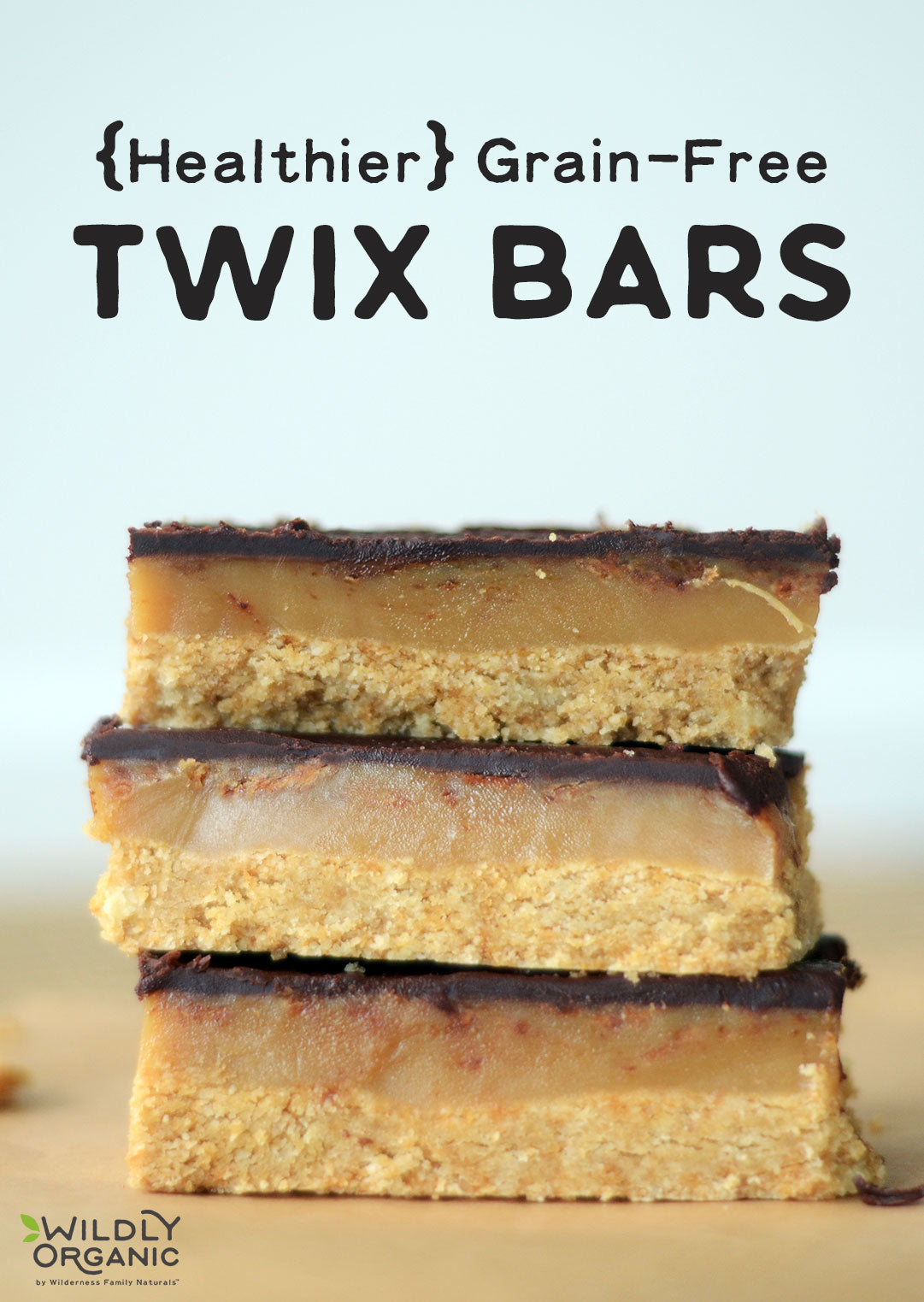 Three grain-free twix bars stacked on top of each other on a table. 