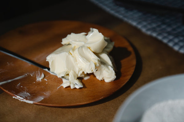 Creamy butter substitute on a wooden plate