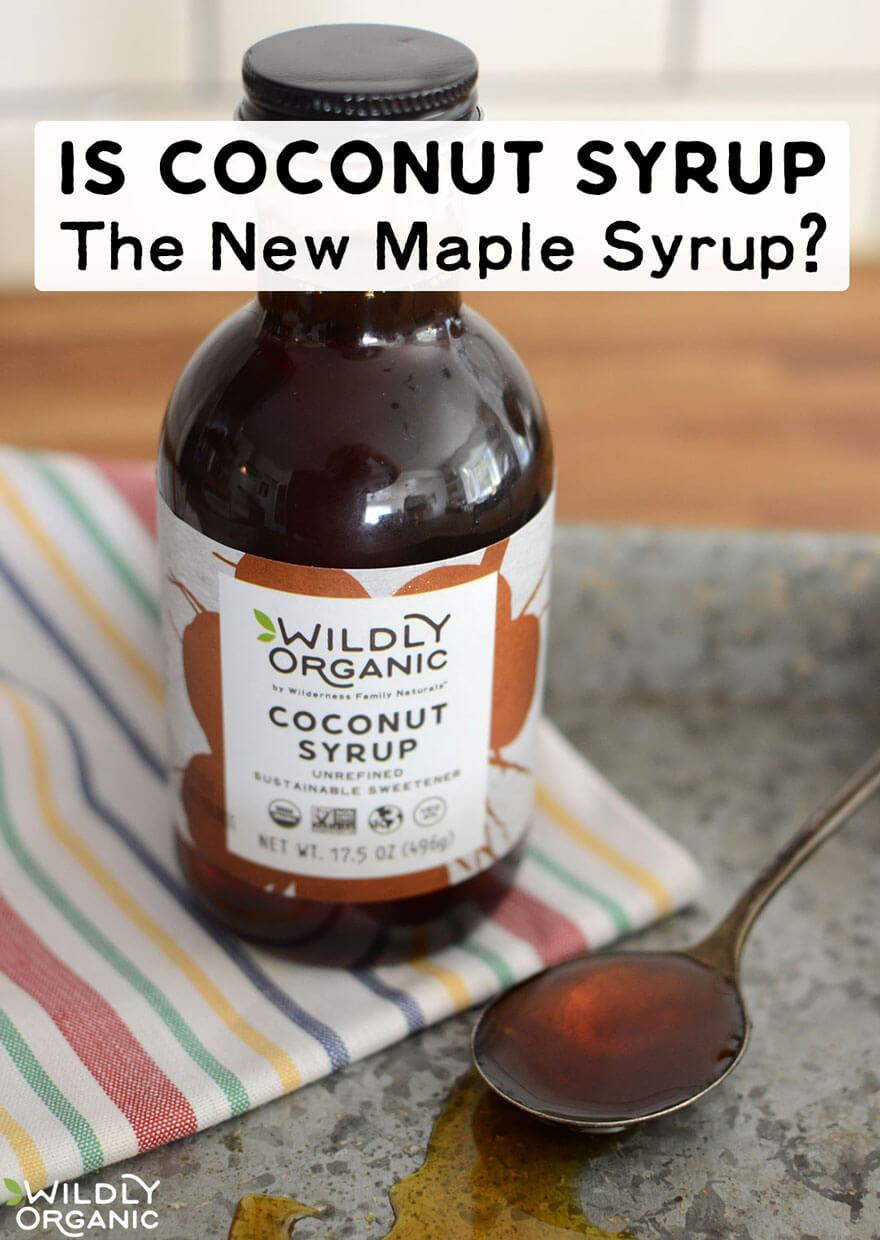 A bottle of Wildly Organic Coconut Syrup alongside a spoonful of nectar