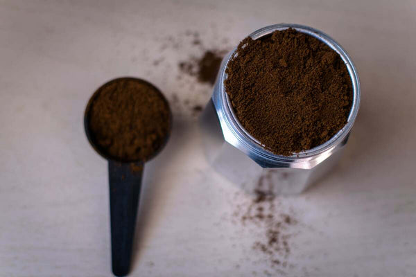 Brown powder in a glass jar and scoop