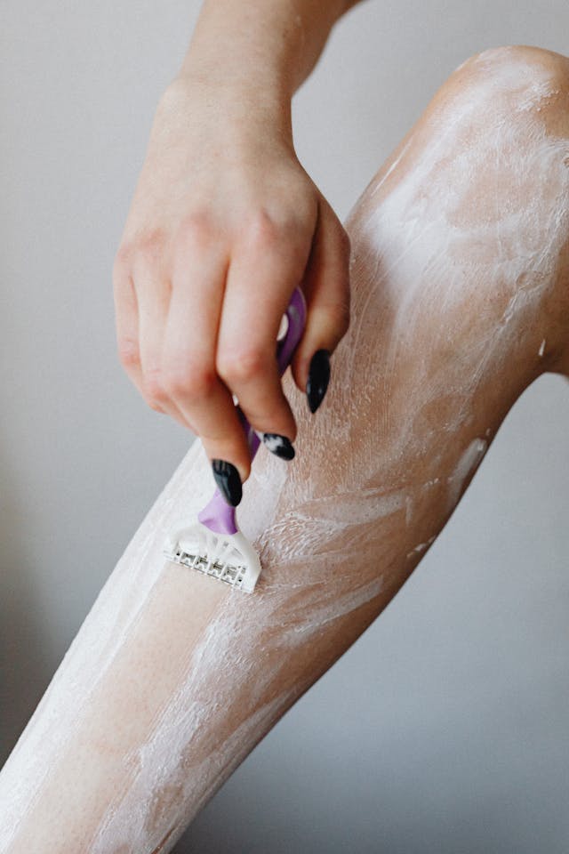 woman shaving with coconut oil