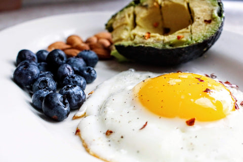 Blueberries, avocado, almonds, and an egg