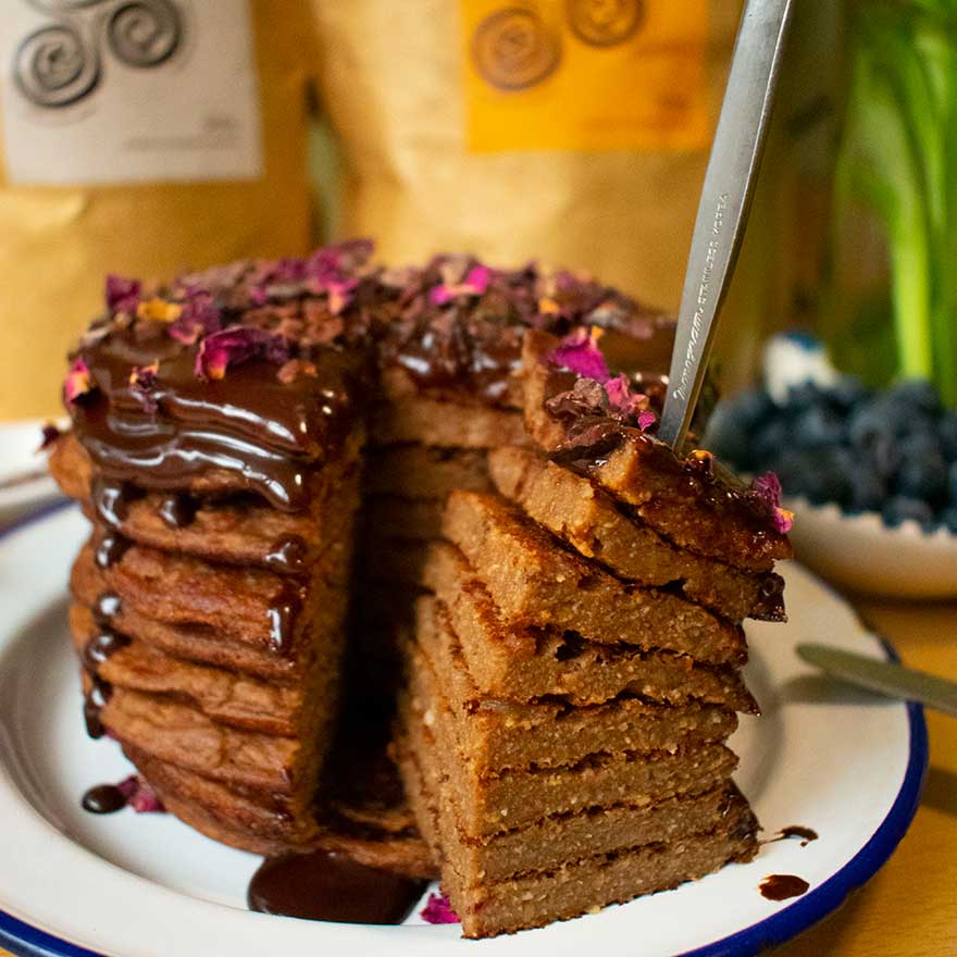 fluffy cacao pancakes stacked and cut