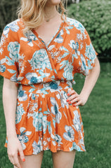 rust and blue floral romper
