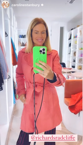 Caroline Stanbury British TV, Podcast & Social Media personality now based in Dubai, wearing The Richmond By-Product Leather Trench Coat in Viburnum Pink.  In the video she exclaimed  ‘Home to this insane, pink leather jacket, its SO fabulous!’ -May 2023